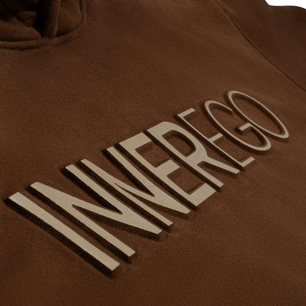 INNER EGO embossed logo detail on brown hoodie - luxury streetwear