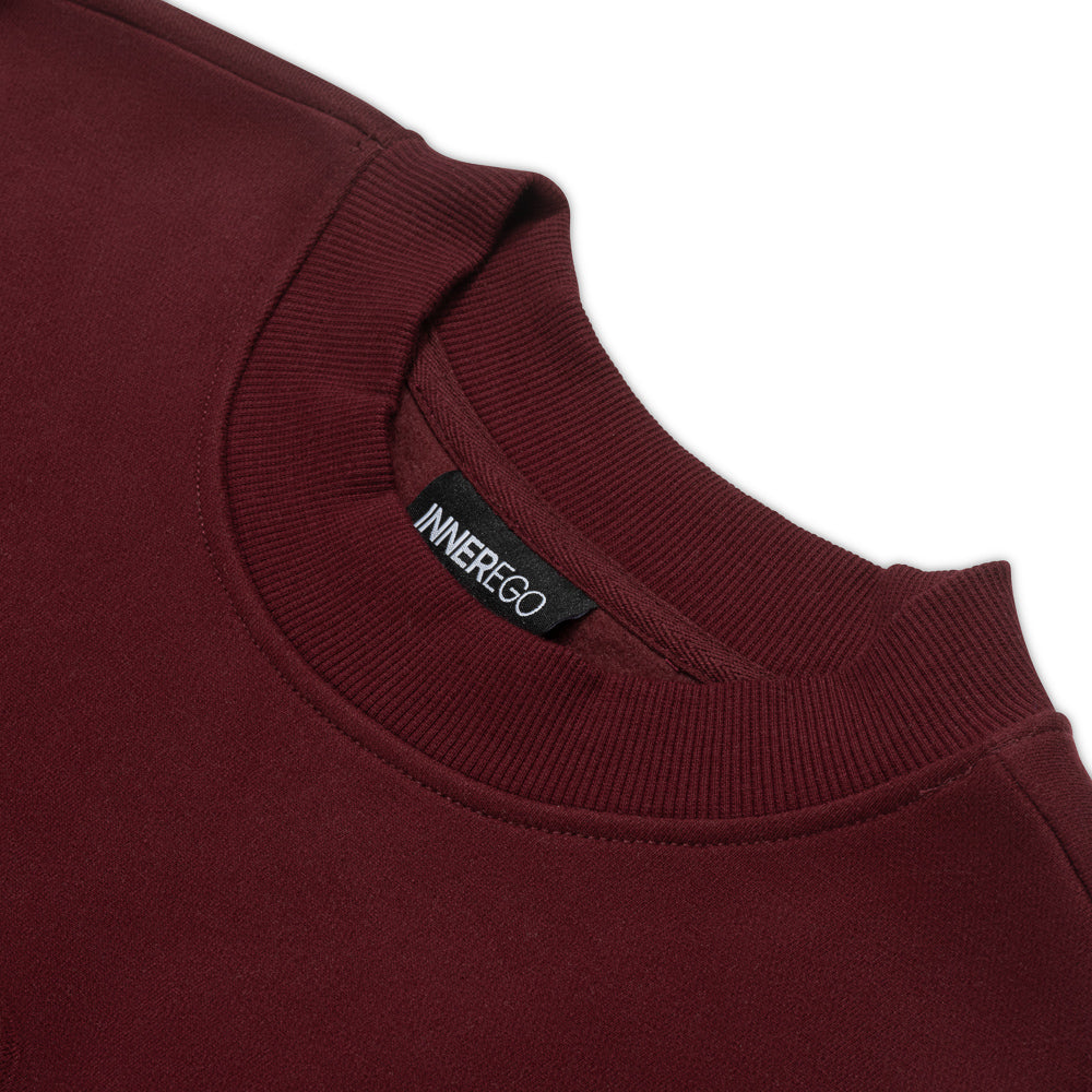burgundy sweatshirt close up neckline on white background